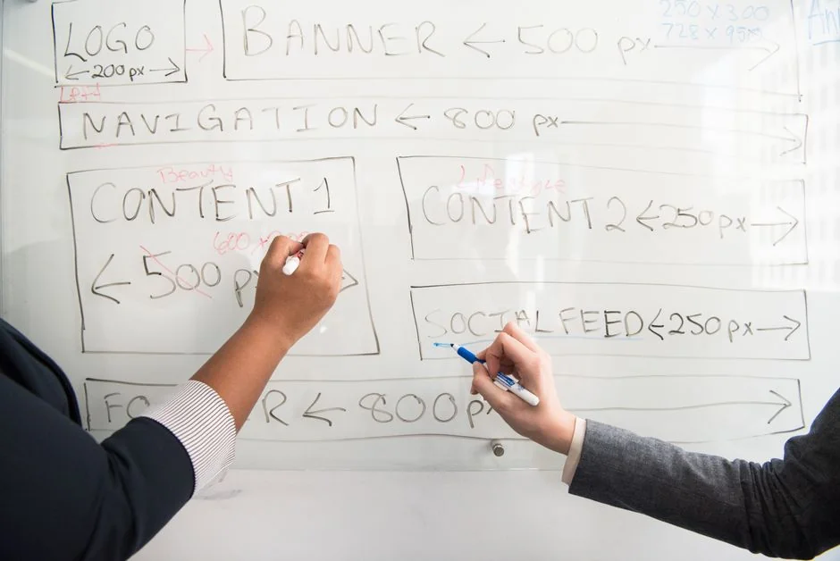 Overhead shot of diverse team analyzing marketing strategies with charts and graphs.